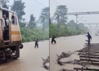 आगे लाल झंडी लेकर चलता रहा रेलकर्मी, पीछे पानी चीरती चलती रही ट्रेन… पटरियों पर चढ़ा 3 फीट पानी